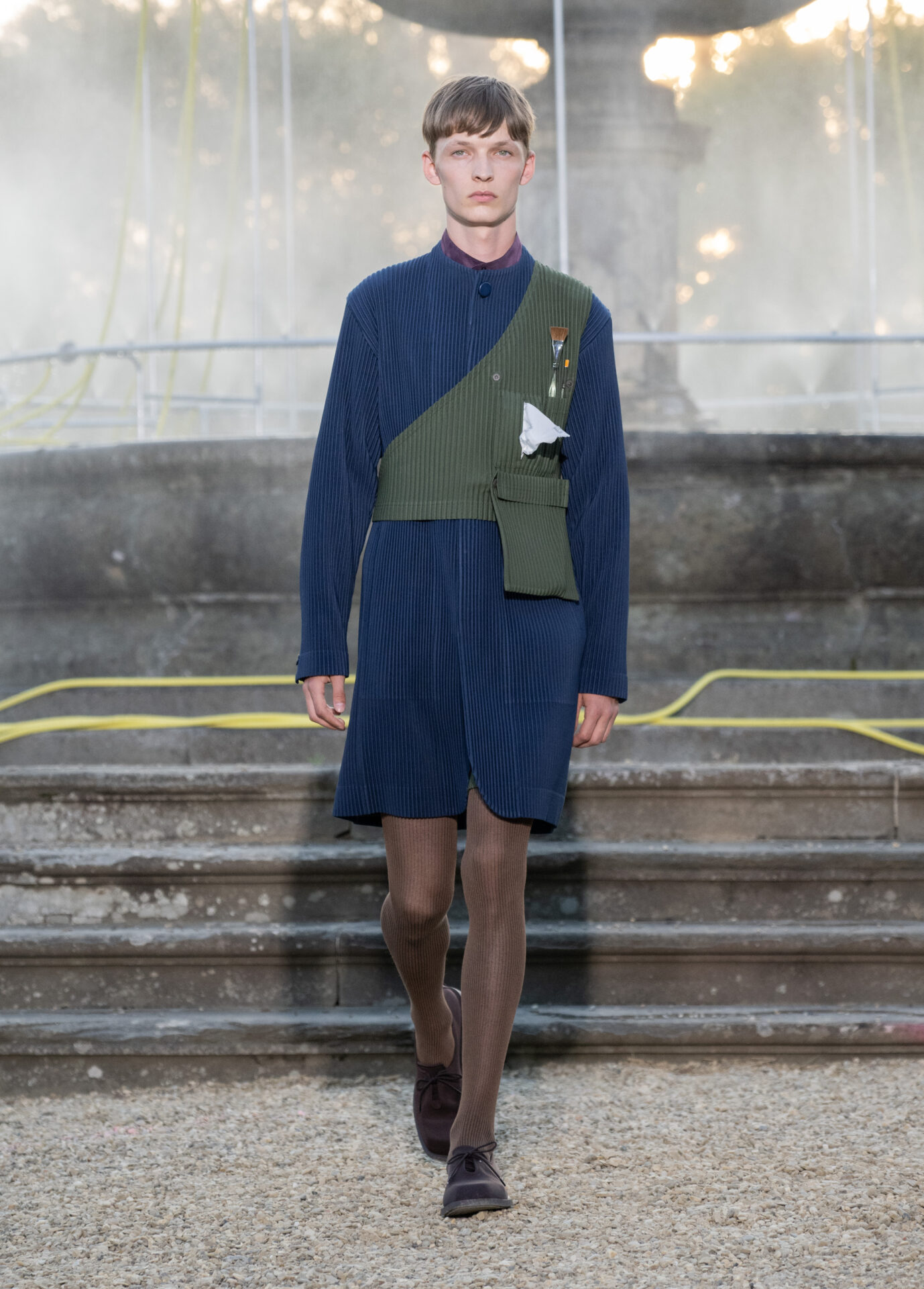 Homme Plissé Issey Miyake at Pitti: coat hanger coats and oil